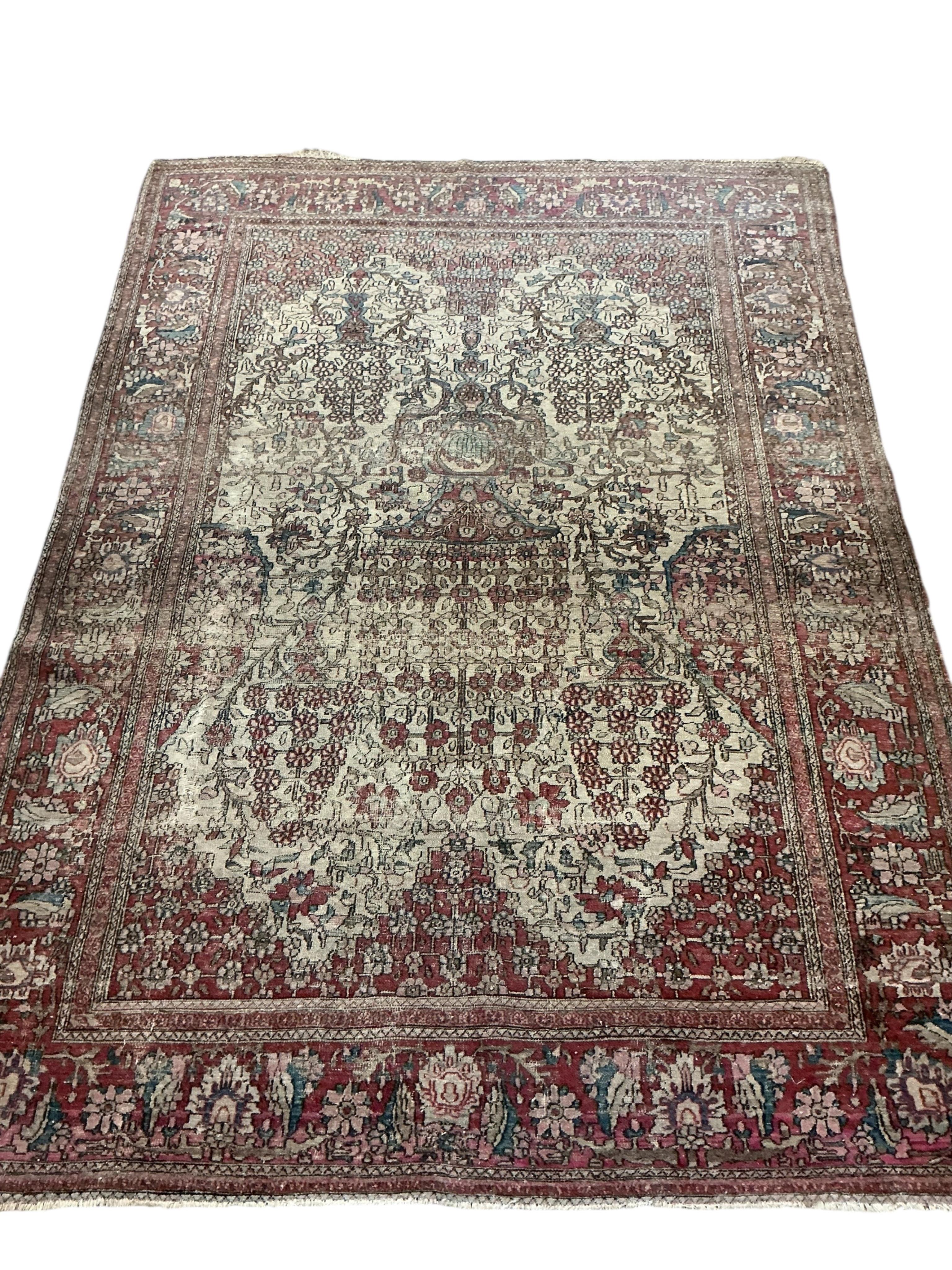 Two antique Isphahan rugs, (worn), larger 194 x 138cm